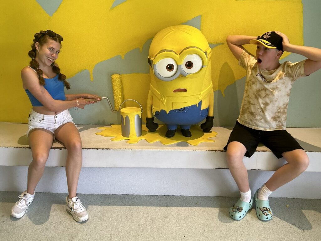Kids painting a minion at universal studios florida