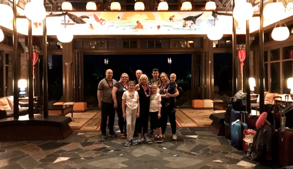 Family picture at Aulani lobby after Aulani Airport Shuttle